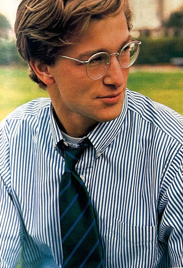 man in button up shirt, glasses, striped tie