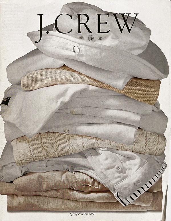 spring cover of jcrew, folded sweaters, button ups, chinos and a bucket hat on top