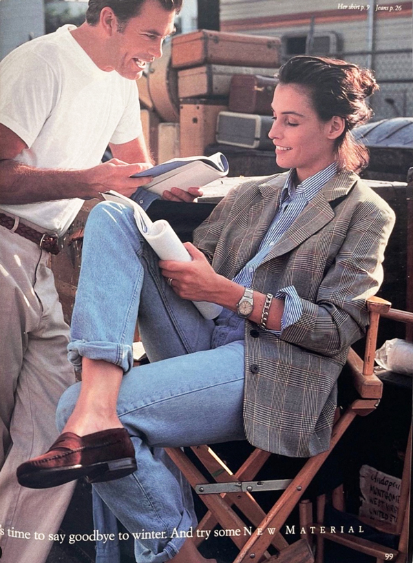 movie director in chair with blazer and jeans. man in white t shirt and chinos