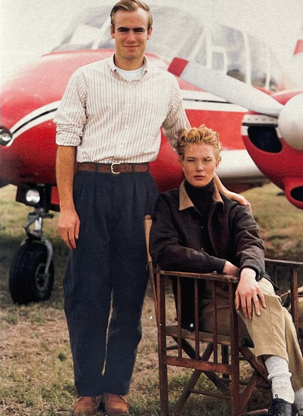 pilots, man and woman, navy pants, belt, button up, brown jacket, chinos